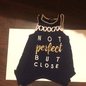 A t-shirt that says “not perfect but close”